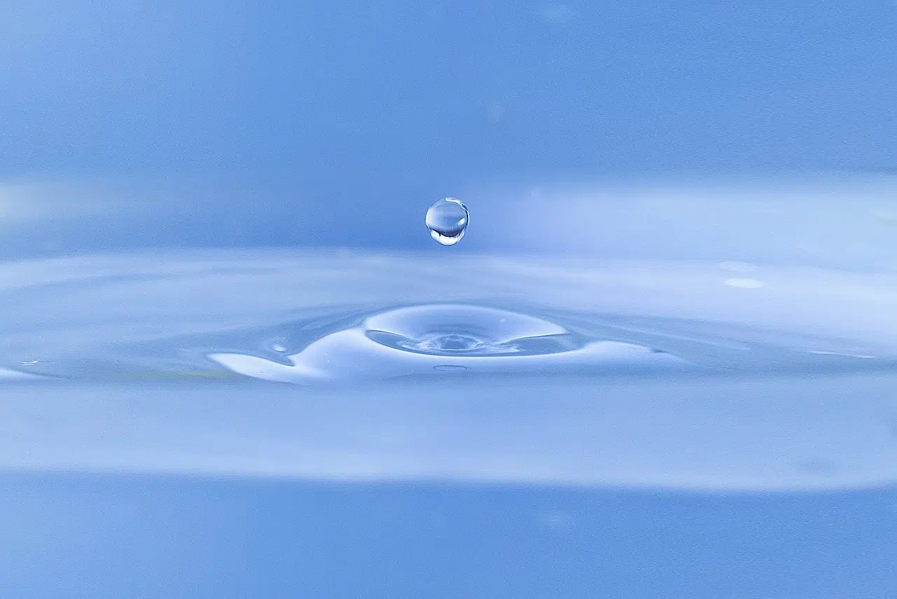 A water drop impacting a surface, representing sustainable water management and water conservation strategies.