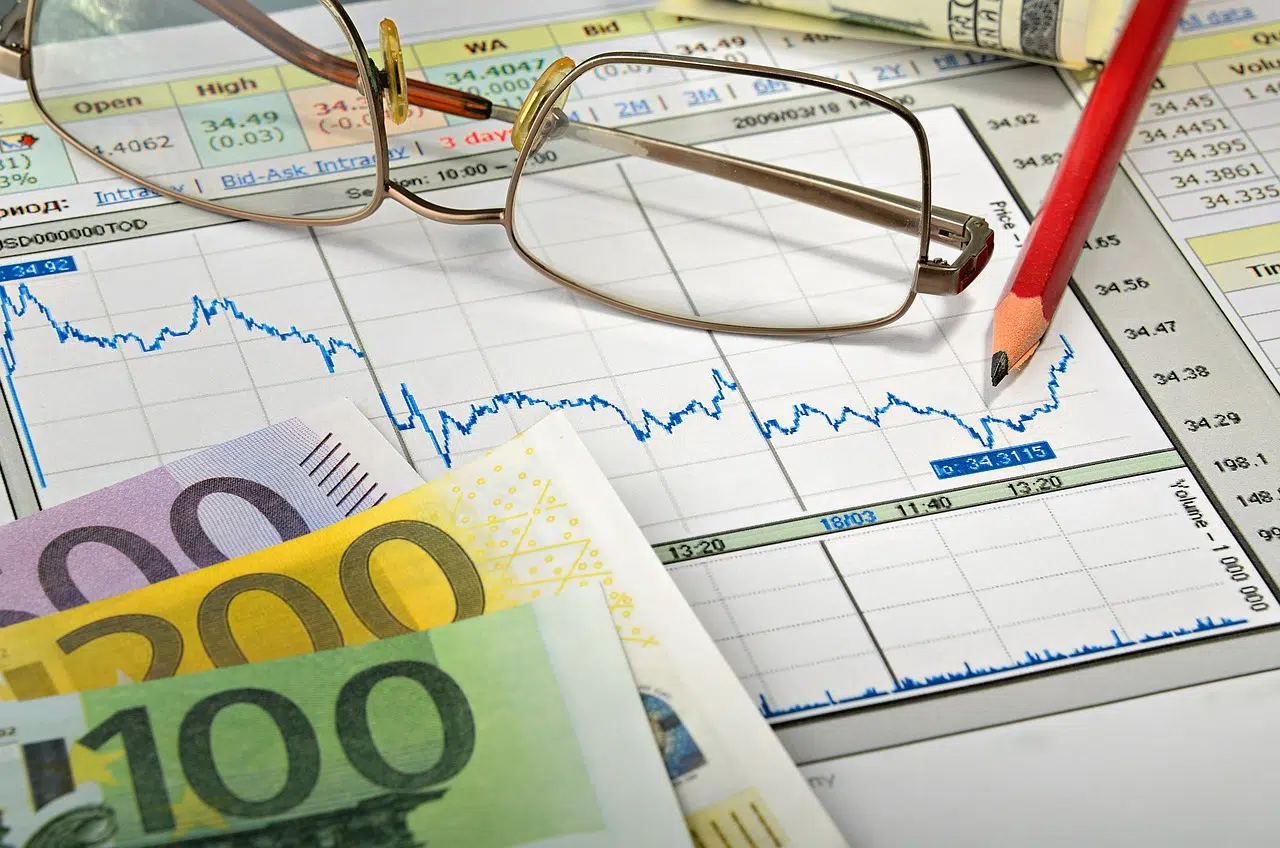 Economic charts and euro bills illustrating the financial benefits of implementing sustainable water management systems.