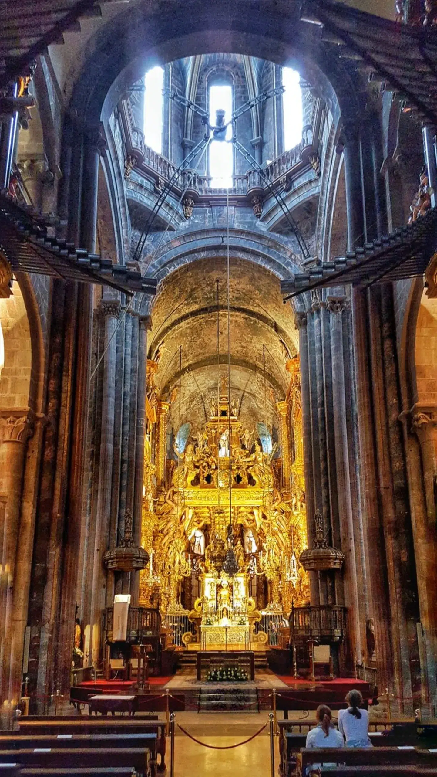 Spanish Architectural Diversity: How Different Spanish Regions Express Design 4 Interior of the Santiago de Compostela Cathedral, showcasing its stunning Baroque altarpiece and the richness of Spanish architectural diversity.