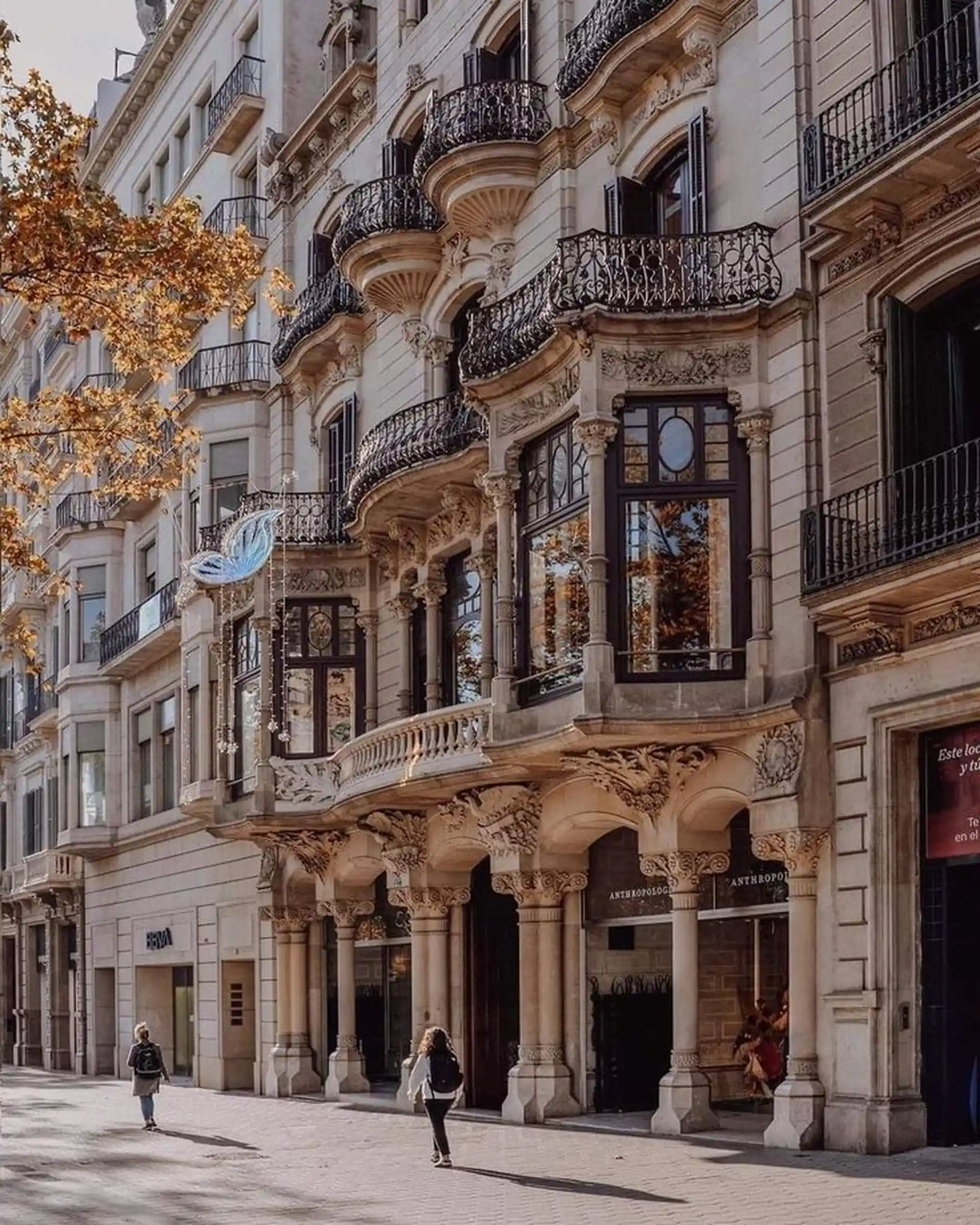 Historical building facade with ornate balconies in Spain