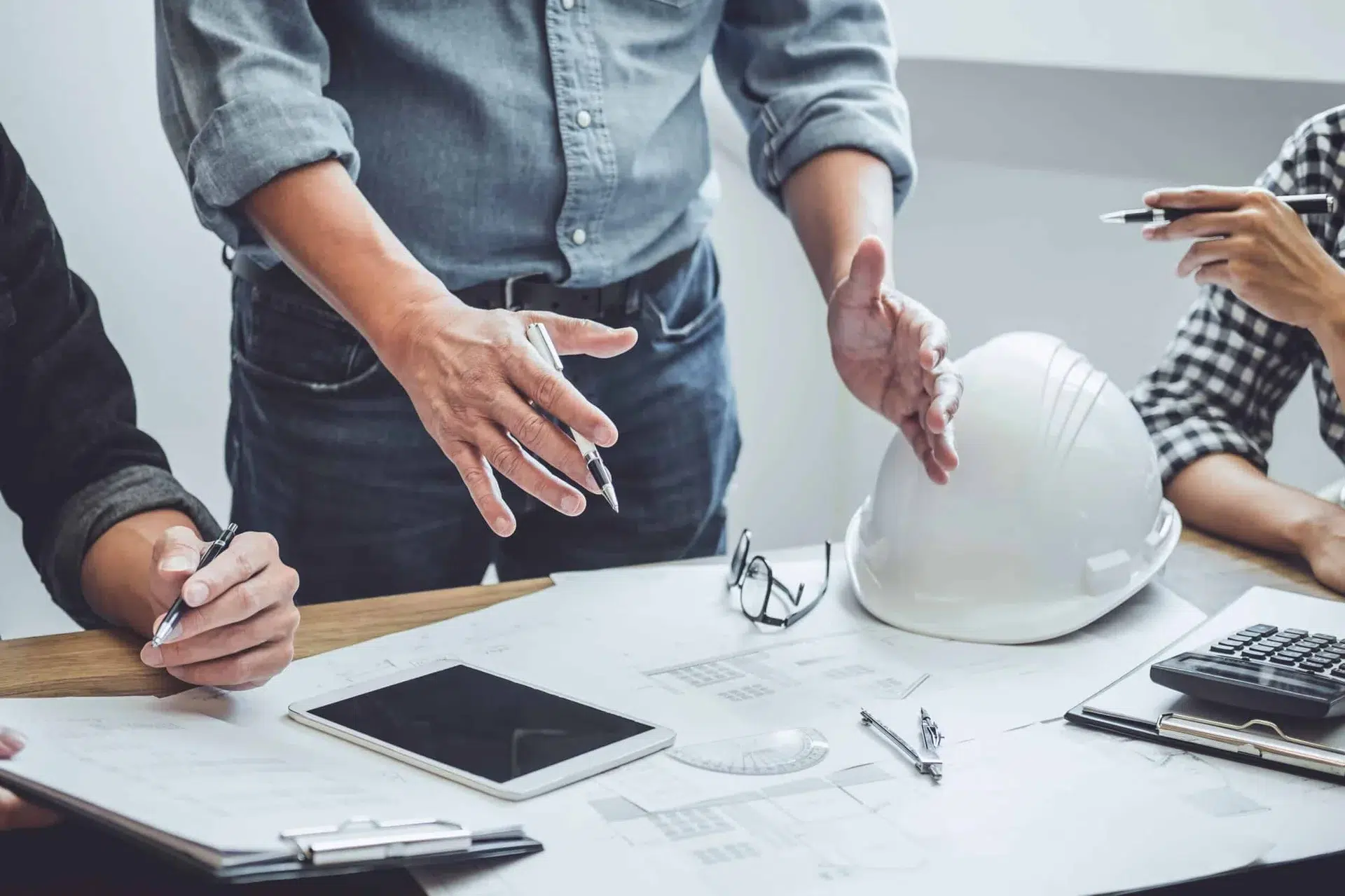 Comprehensive Guide: Obtaining Building Licences for EU Citizens in Murcia and Alicante 3 Architects and engineers preparing technical documents for major building licences in the Costa Blanca