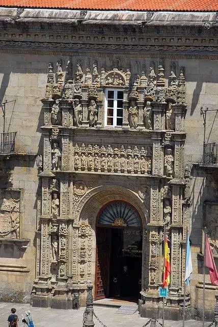 Historic homes restoration in Spain: sculpted façade of the Hostal de los Reyes Católicos in Santiago. 