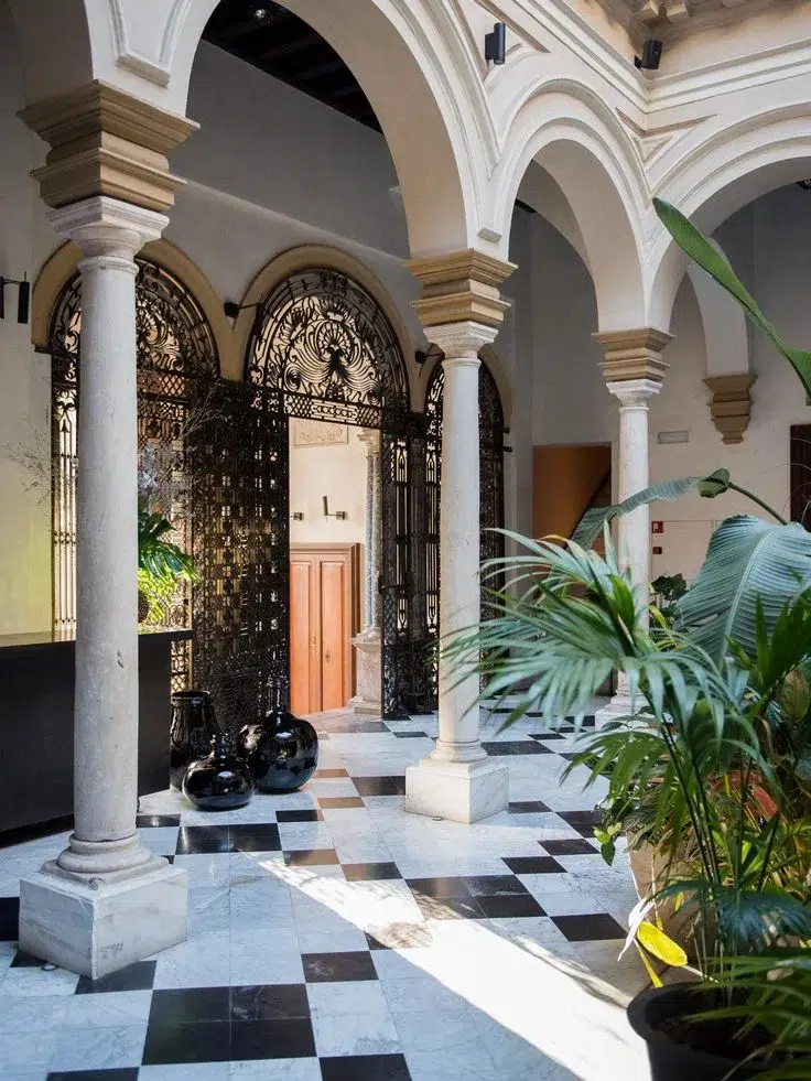 Historic homes restoration in Spain at Hotel Palacio de Villapanés in Seville, traditional courtyard restored.