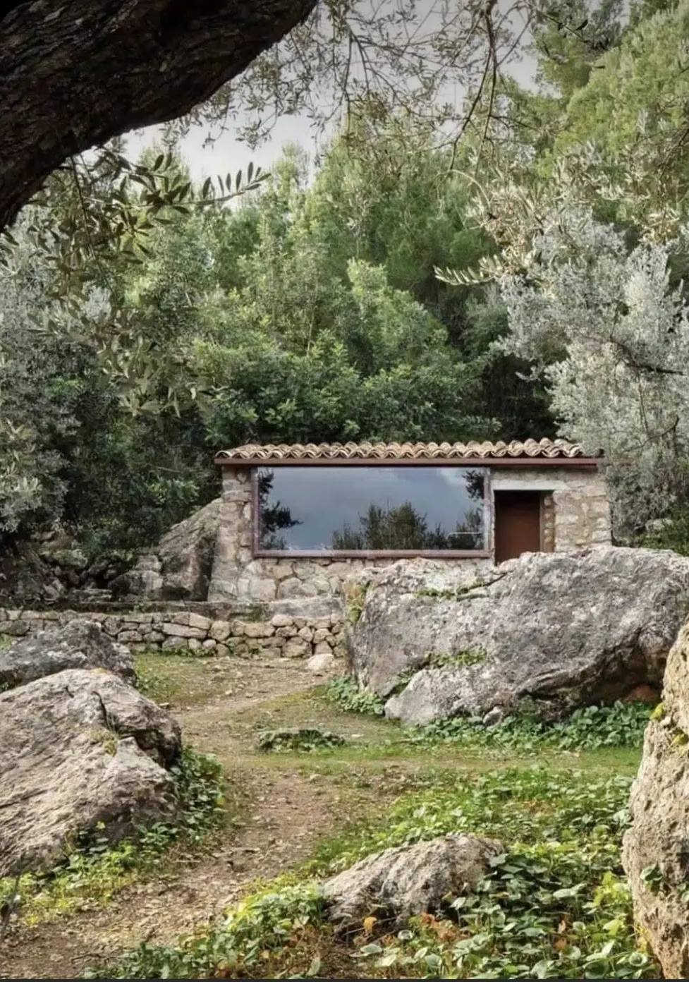 Stone guest retreat in nature, reflecting luxury micro-architecture design