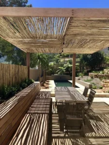 Bamboo pergola with linear shade in patio, dual seasonal design