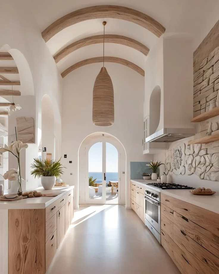 Bright open-plan Spanish kitchen with arches and natural wood