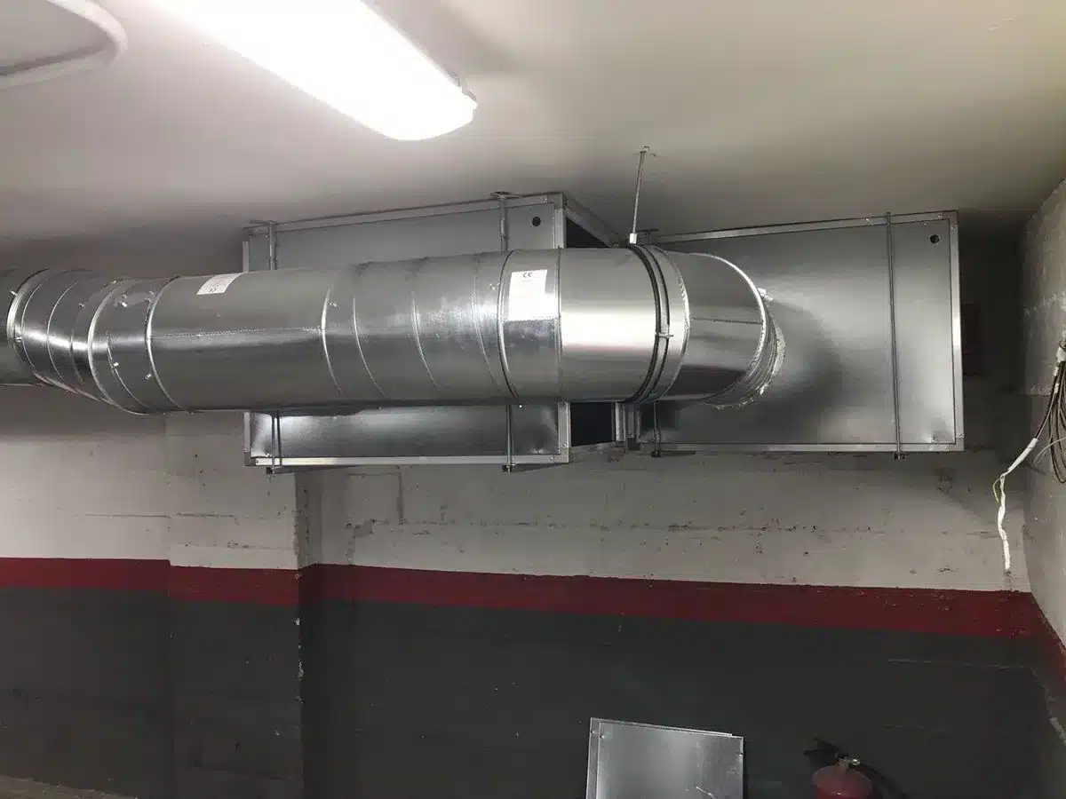 Ductwork and MVHR unit installed in a garage, showing typical location for easy maintenance and reduced noise.